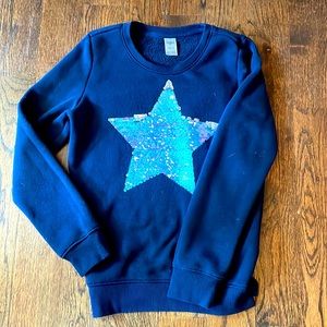 Sequin reversible star on a cozy warm sweatshirt!